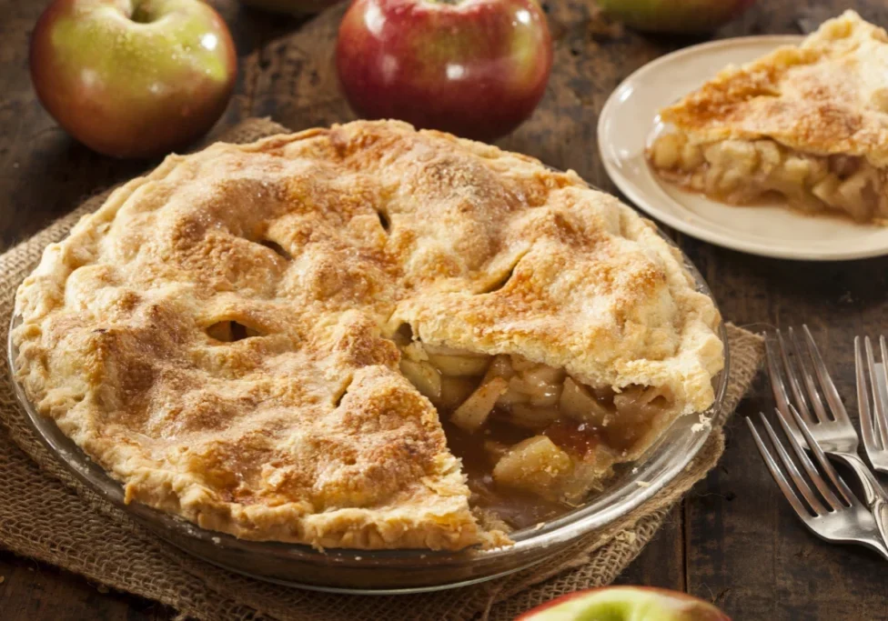 Homemade apple pie, slice removed.